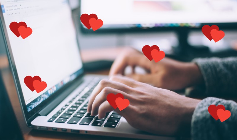 A person working on their WordPress maintenance routine with tiny hearts all around