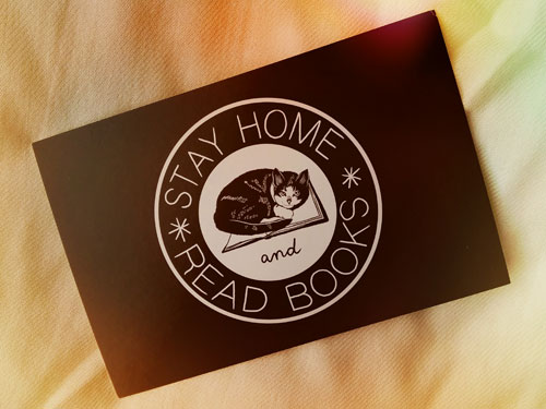 Stay home and read books postcard