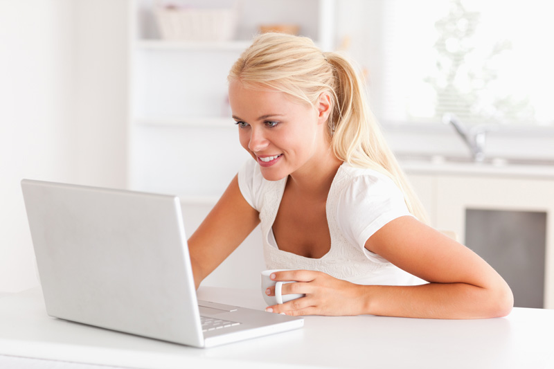 woman in summer clothes doing quick website tasks